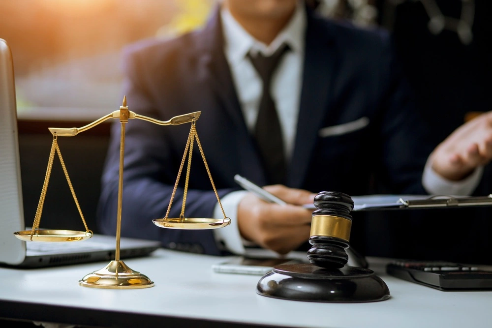 Parents sit with their child and legal papers in a lawyer's office, discussing the details of a Joint Managing Conservatorship arrangement.