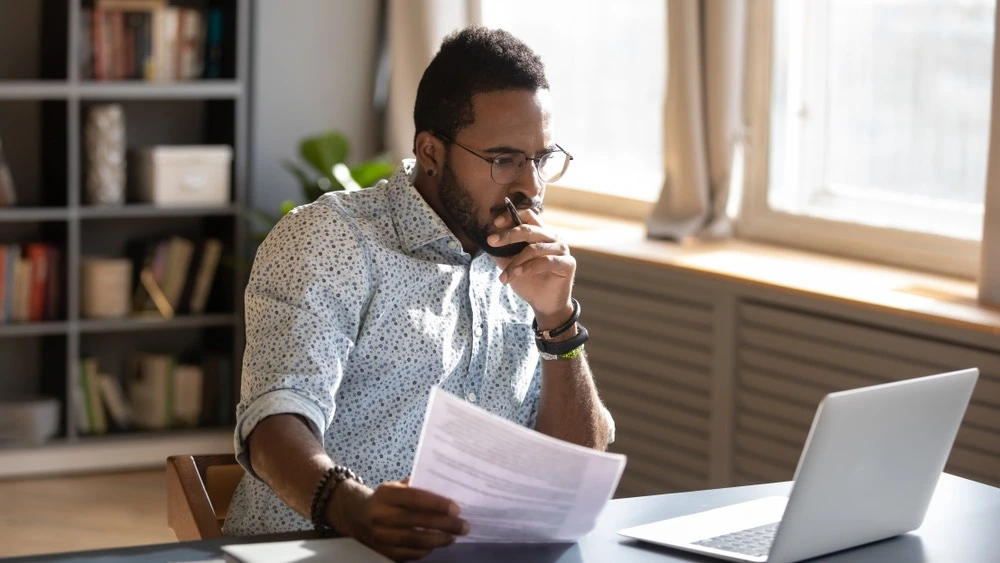 A snapshot of a person organizing legal documents and evidence for a trial