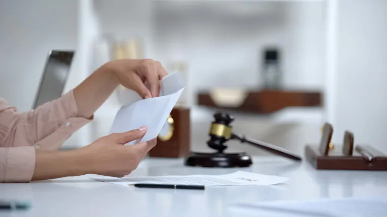 Parents sit with their child and legal papers in a lawyer's office, discussing the details of a Joint Managing Conservatorship arrangement.