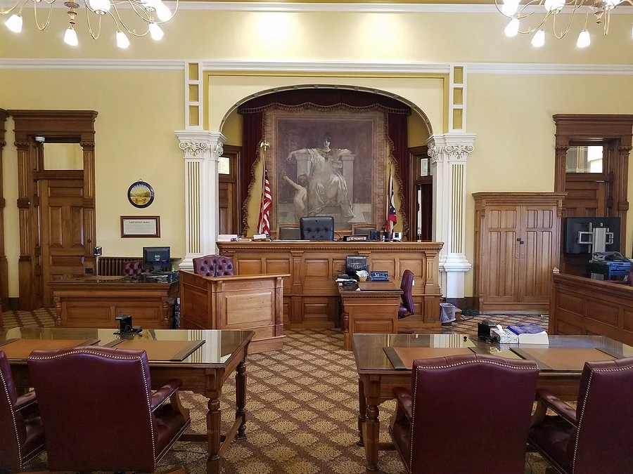 A courtroom snapshot representing the decisive moment as a judge in Texas delivers a final verdict in a divorce trial