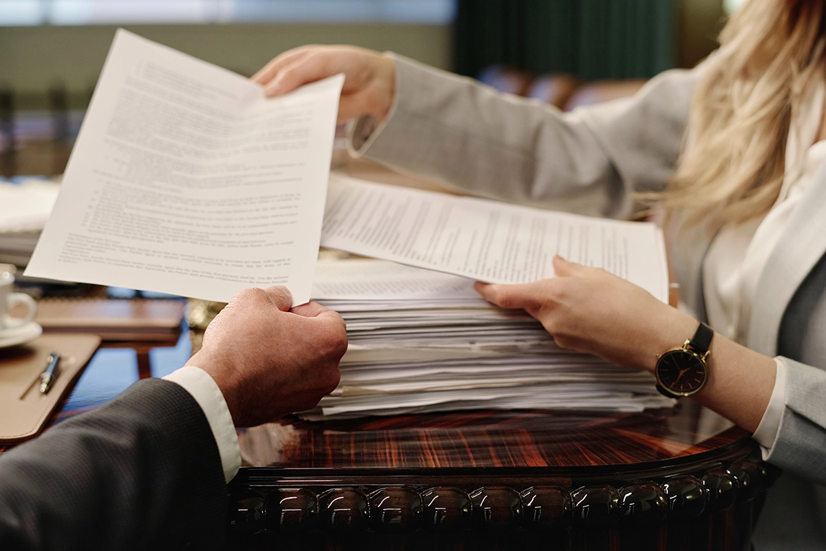 businesswoman giving paper to her male colleague 2025 02 11 15 44 34 utc businesswoman giving paper to her male colleague
