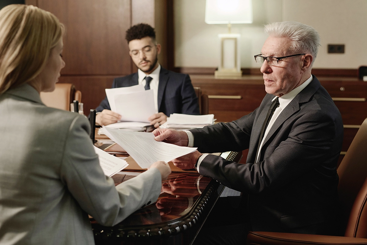 group of business people doing paperwork sitting i 2025 02 11 15 41 42 utc group of business people doing paperwork