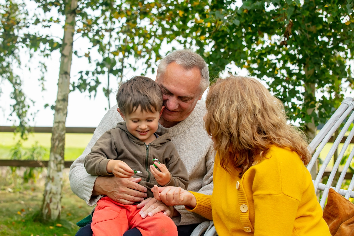 grandparents grandparents playing with their grandson